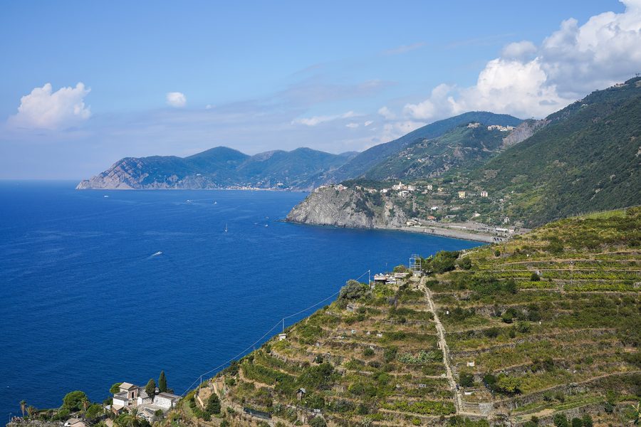 View over the terraced coast of the Cinque Terre with Manarola, Corniglia and Monterosso